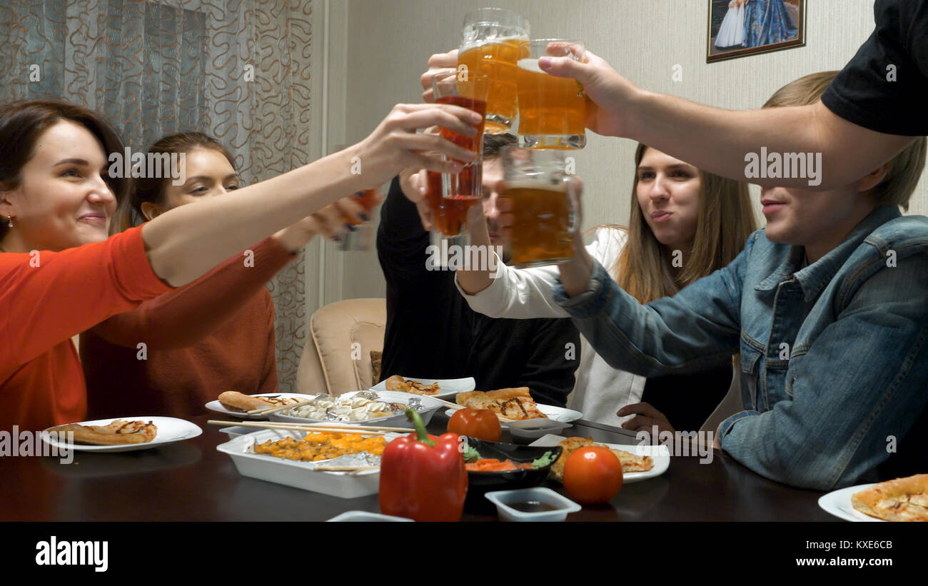 Friends eat and talk at a dinner party at home. Dinner with friends