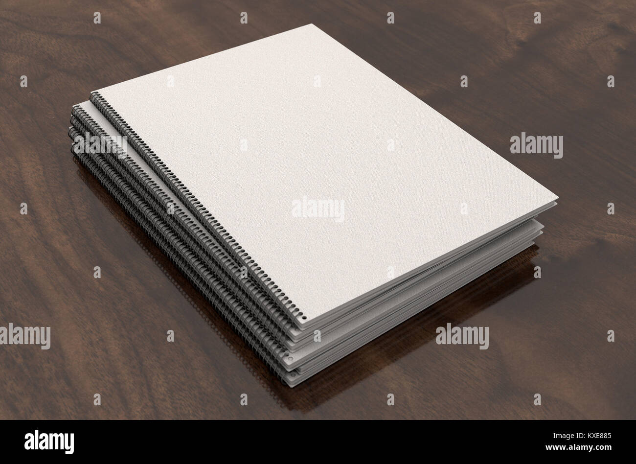 A pile of blank wire bound book documents in a pile on a boardroom table surface - 3D render Stock Photo