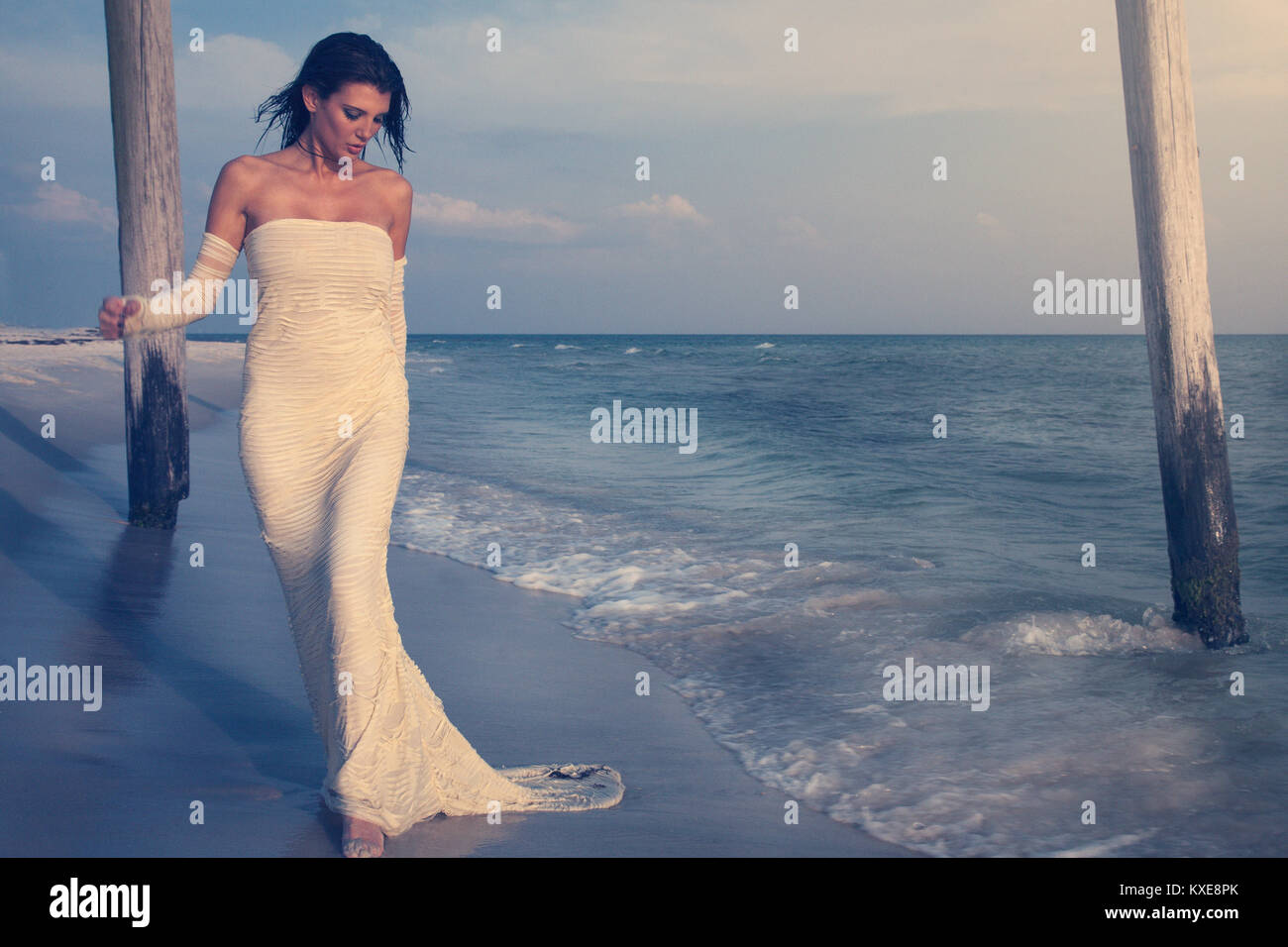 Beautiful woman laying on beach hi-res stock photography and images - Alamy