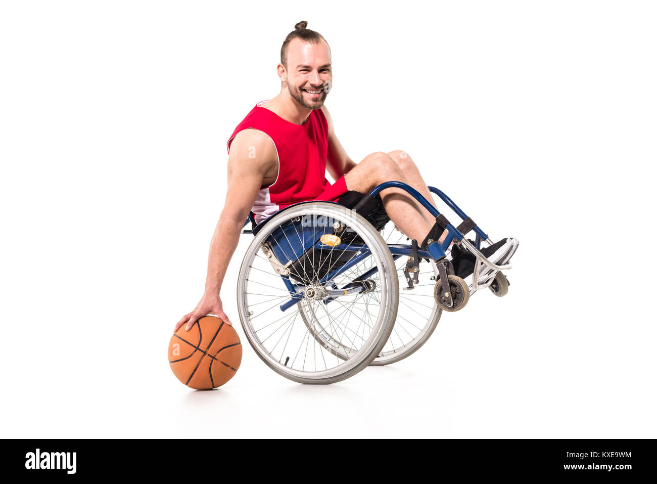 sportsman in wheelchair playing basketball Stock Photo
