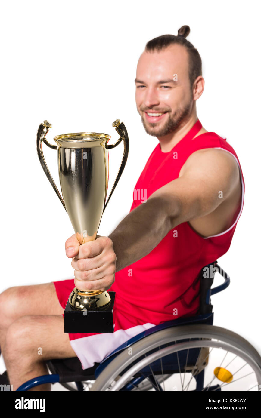 Sportsman in wheelchair with trophy Stock Photo Alamy
