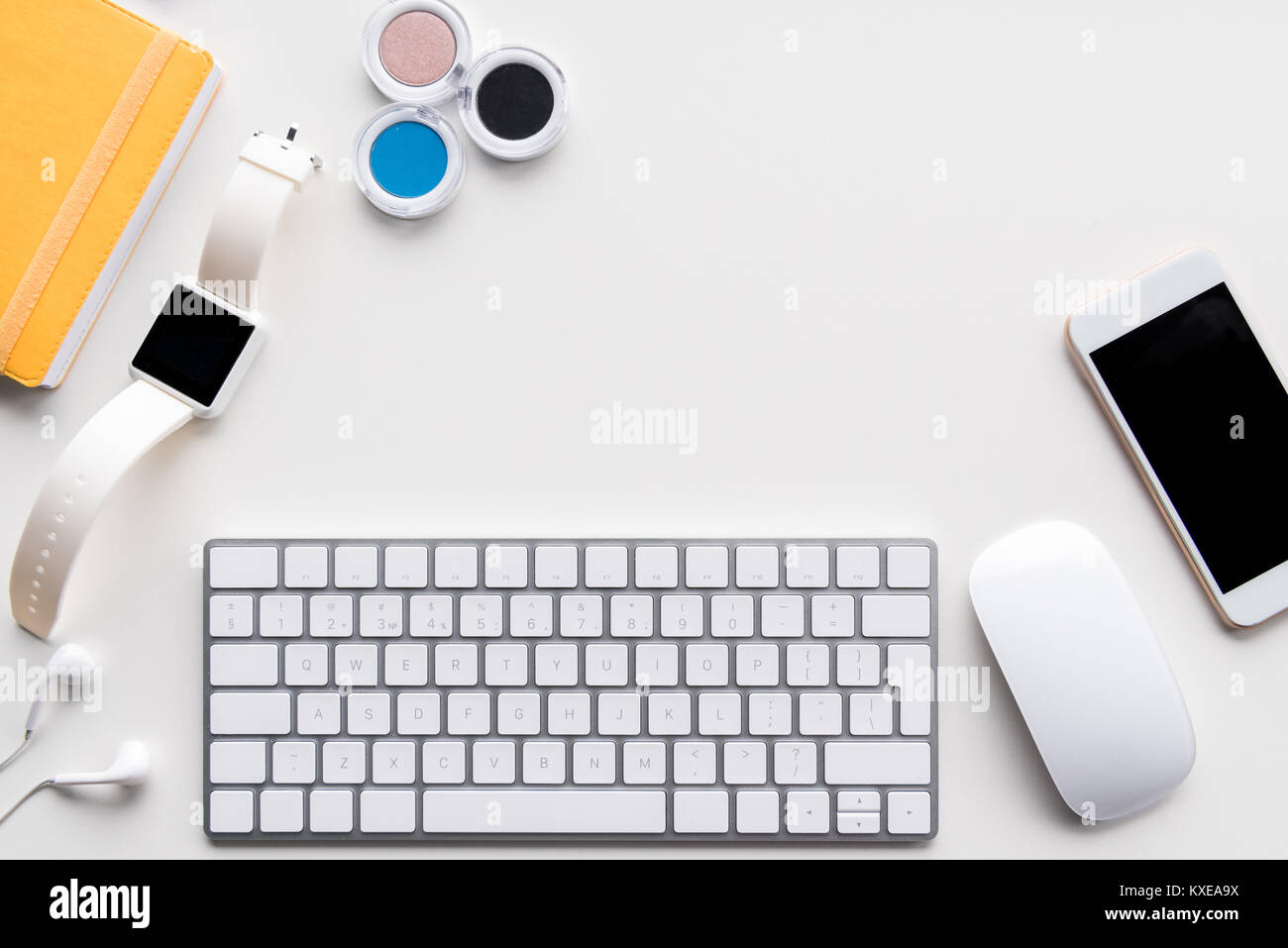 flat lay with computer keyboard, smartwatch, smartphone and office ...