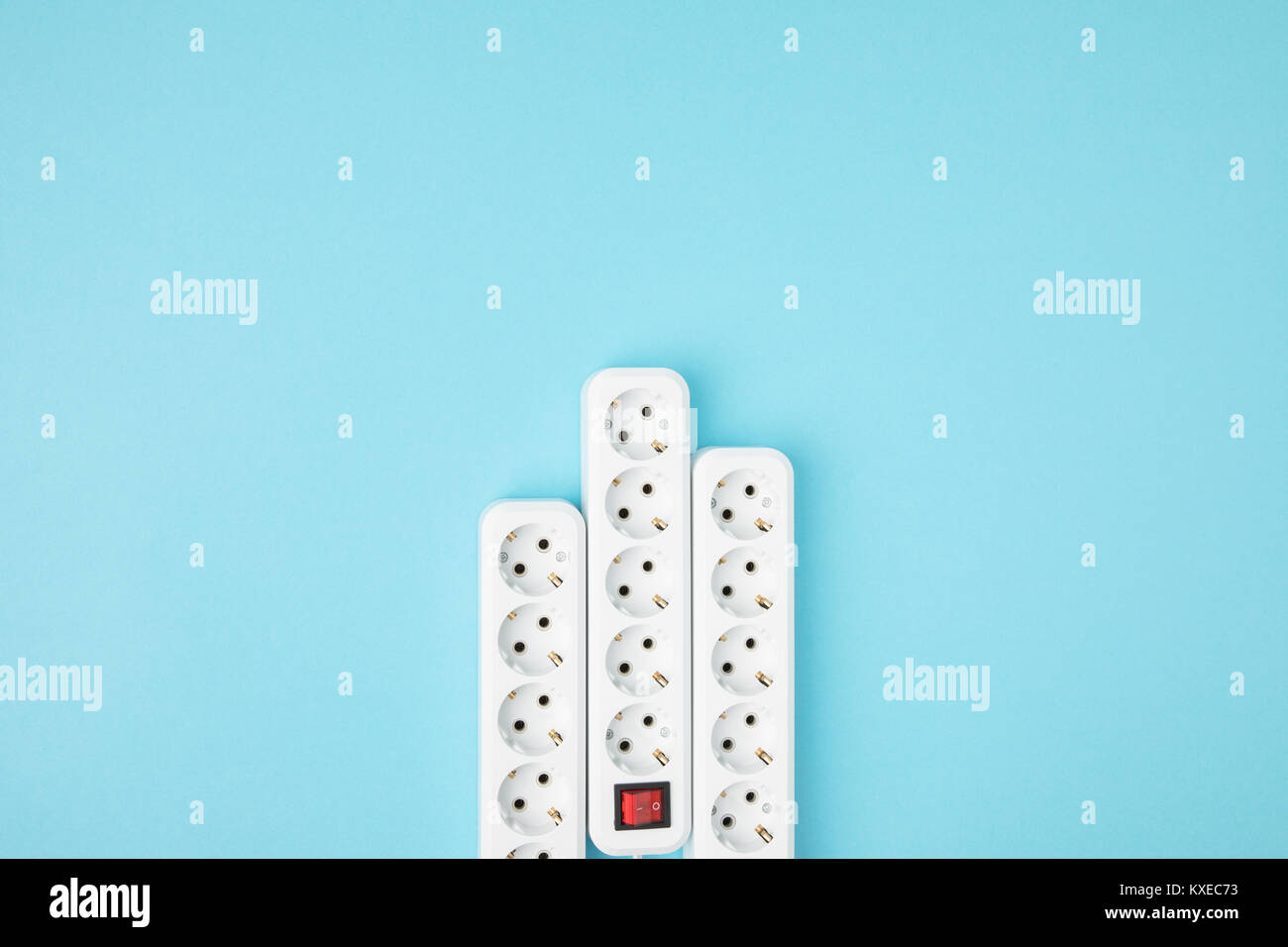 top view of arrangement of extension cords isolated on blue Stock Photo