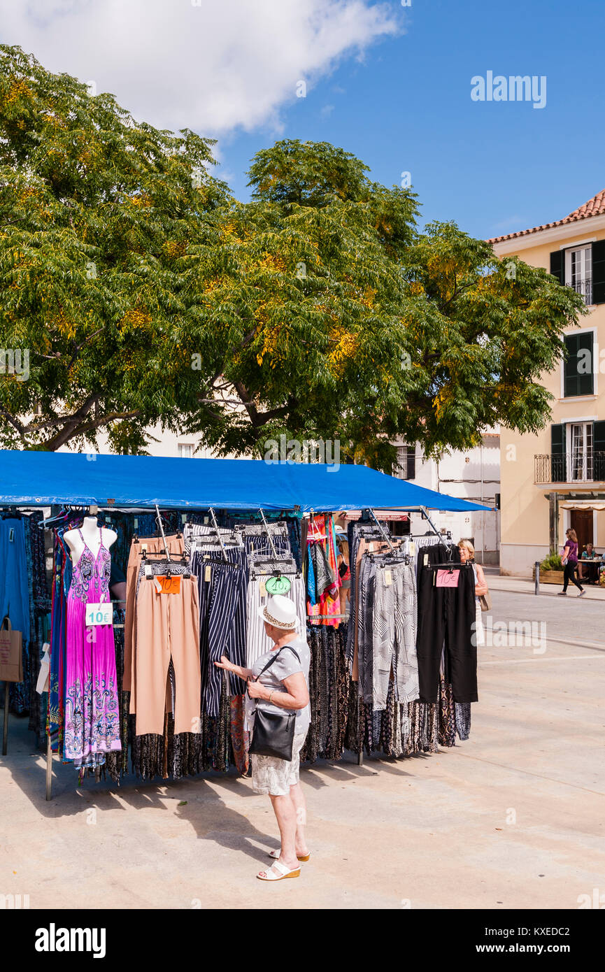 Clothing for sale at the street market in Mahon , Menorca , Balearic Islands , Spain Stock Photo