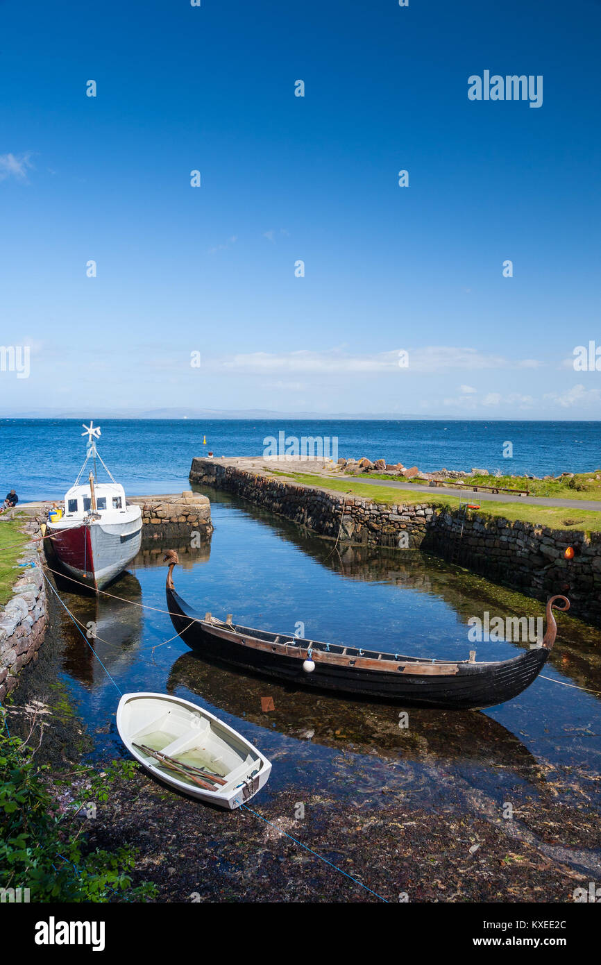 Viking style boat moored at Corrie harbour and village, Isle of Arran, Scotland, UK Stock Photo