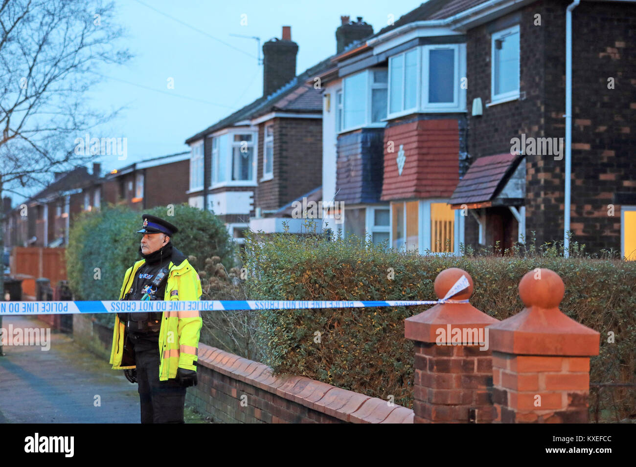 Police at the scene of an investigation at Matlock Road in Reddish on the outskirts of Manchester, as a woman who walked into a police station and said she killed a man several years ago and buried his body in her back garden has been arrested on suspicion of murder. Stock Photo
