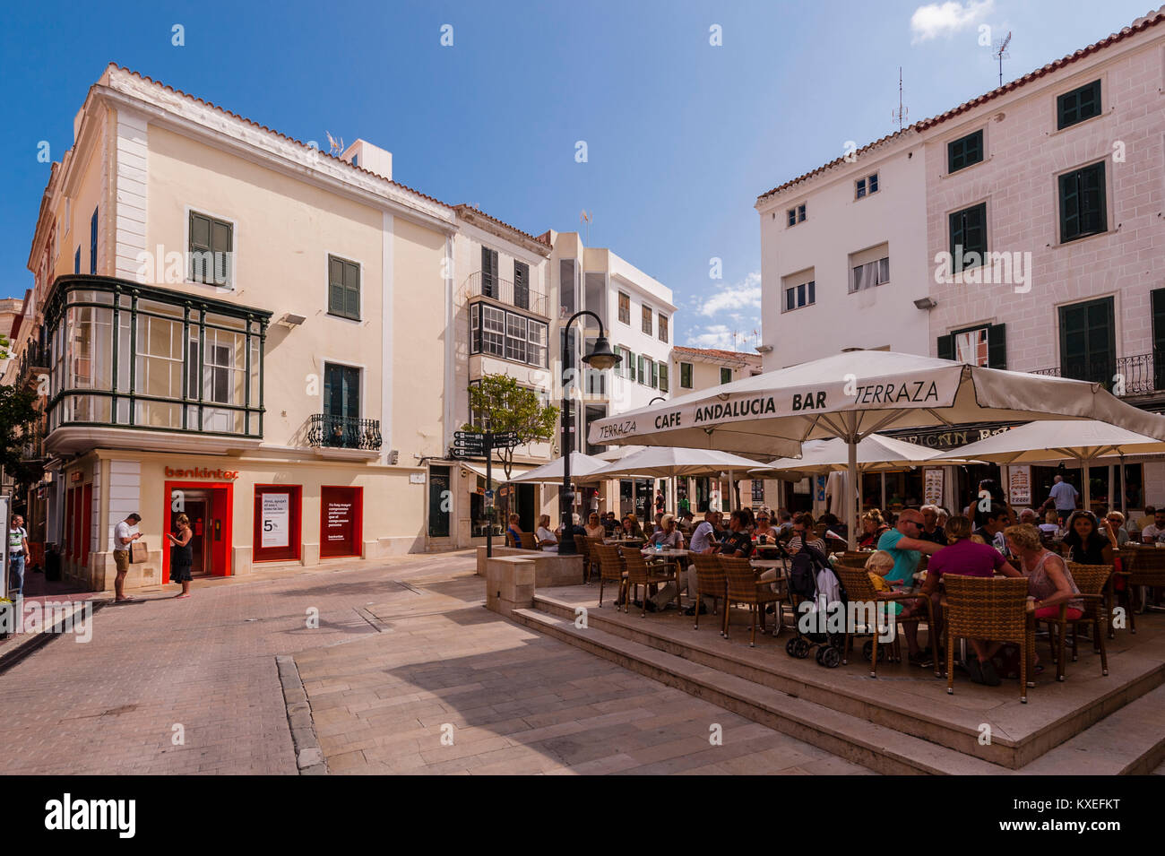 People sitting outside at a bar cafe in Mahon , Menorca , Balearic Islands , Spain Stock Photo