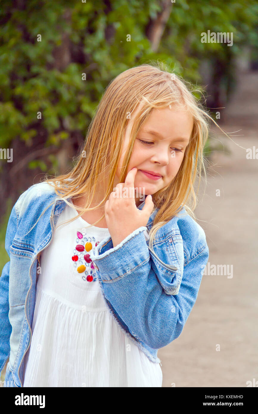 Cute girl with blond long hair in summer Stock Photo - Alamy