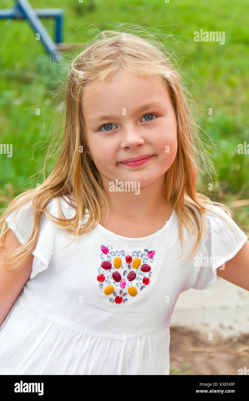 Cute girl with blond long hair in summer Stock Photo - Alamy