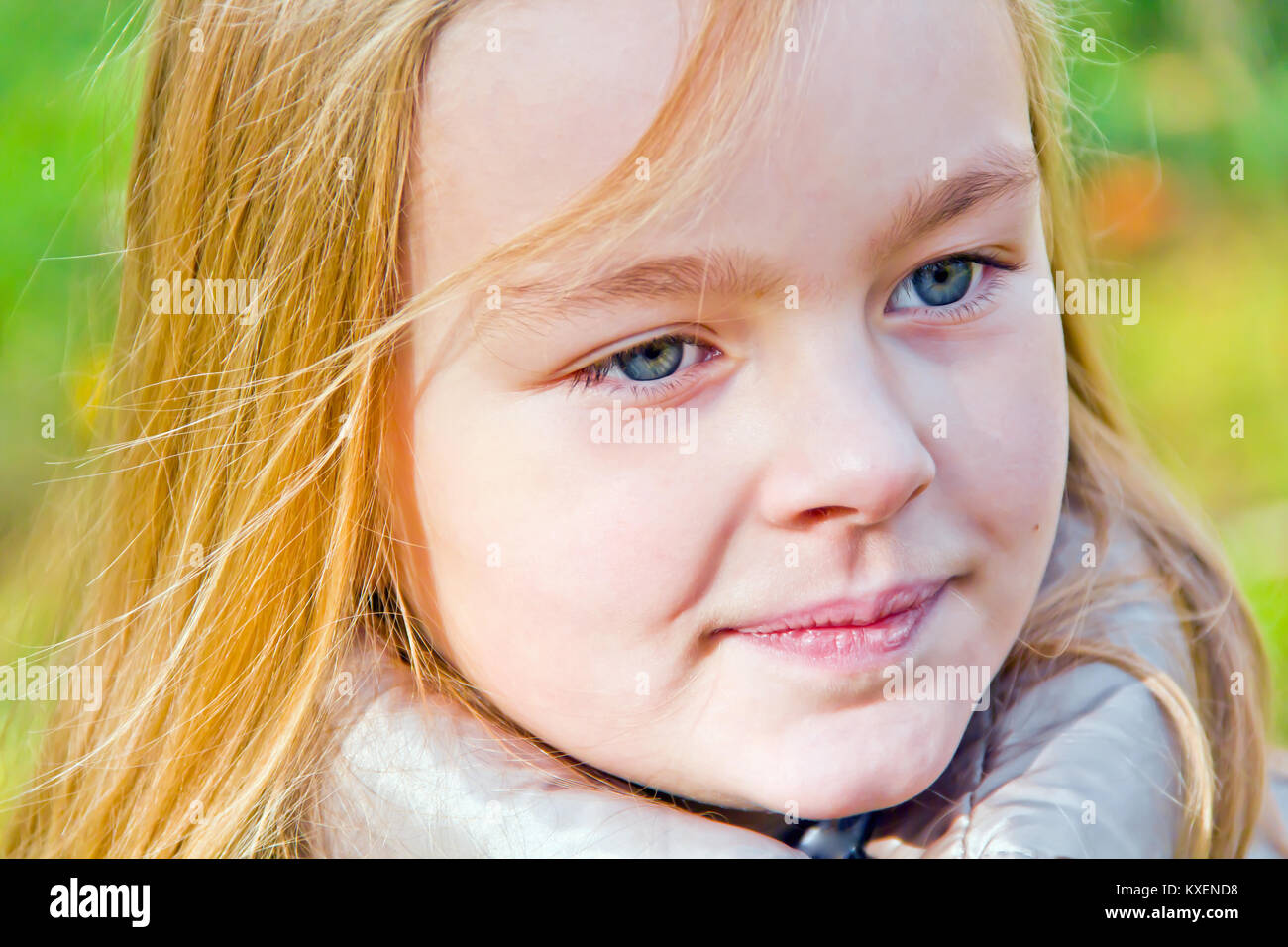 Photo of cute smiling girl in autumn Stock Photo - Alamy