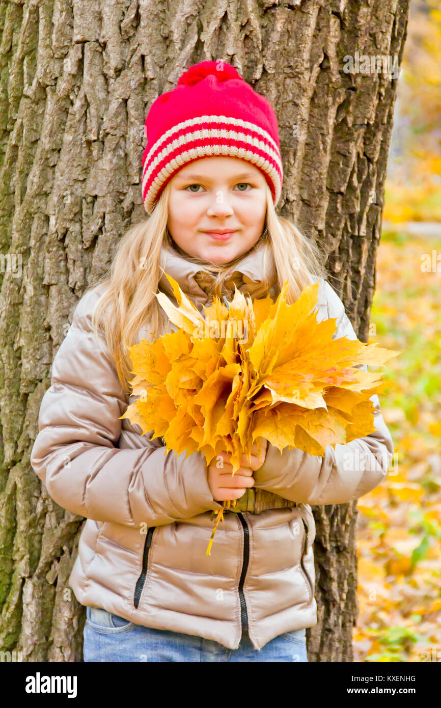 Photo of cute smiling girl in autumn Stock Photo - Alamy
