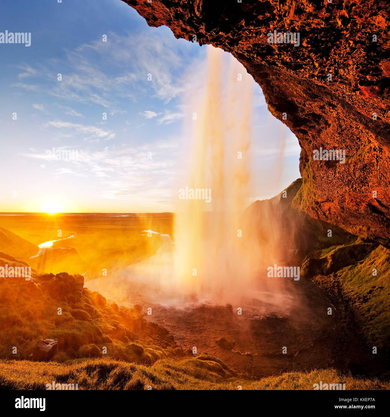 Seljalandsfoss waterfall in the back light, Seljalandsa river, South Island, Island Stock Photo