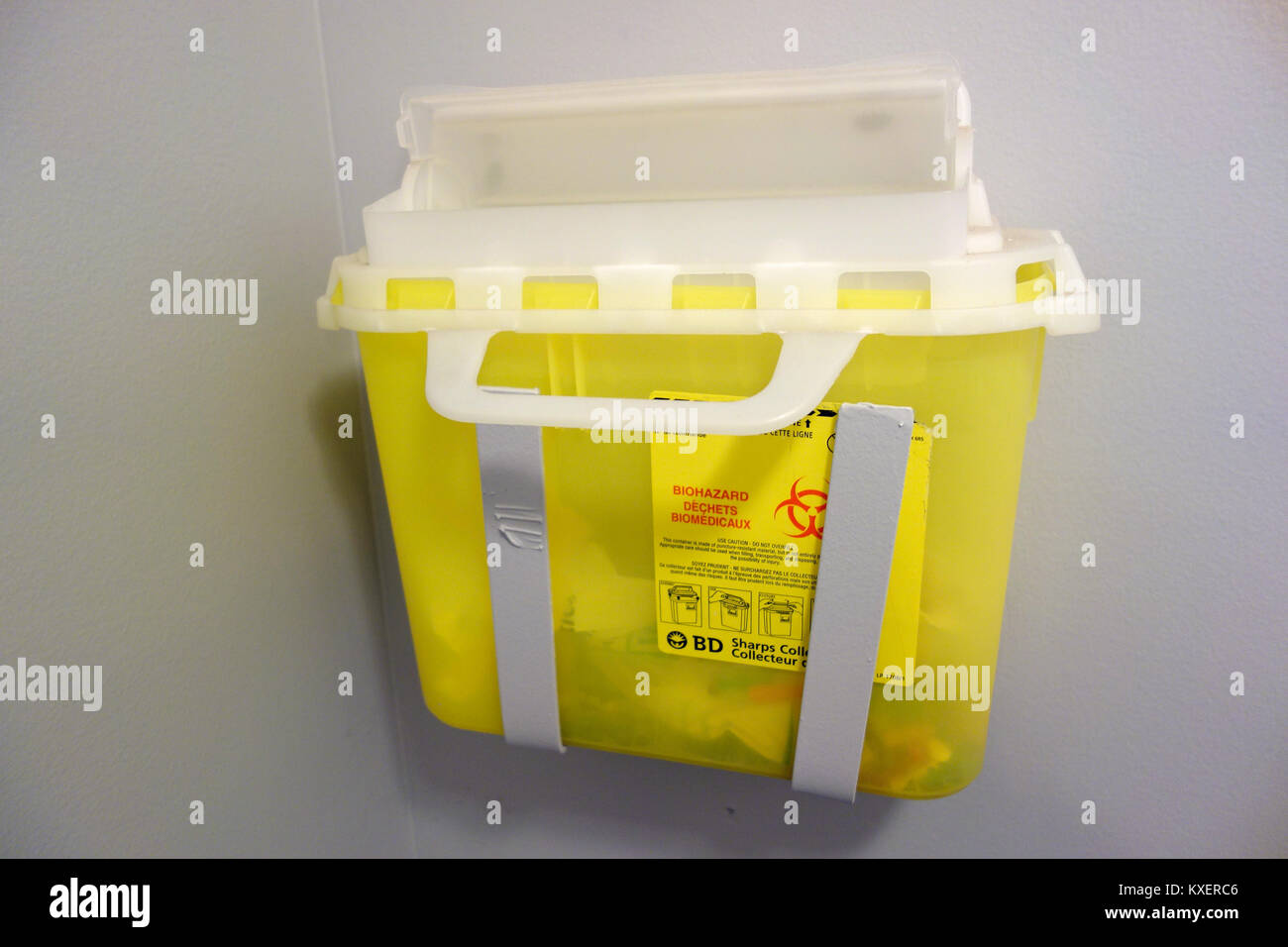 A disposal or collection box for needle sharps in a washroom Stock Photo