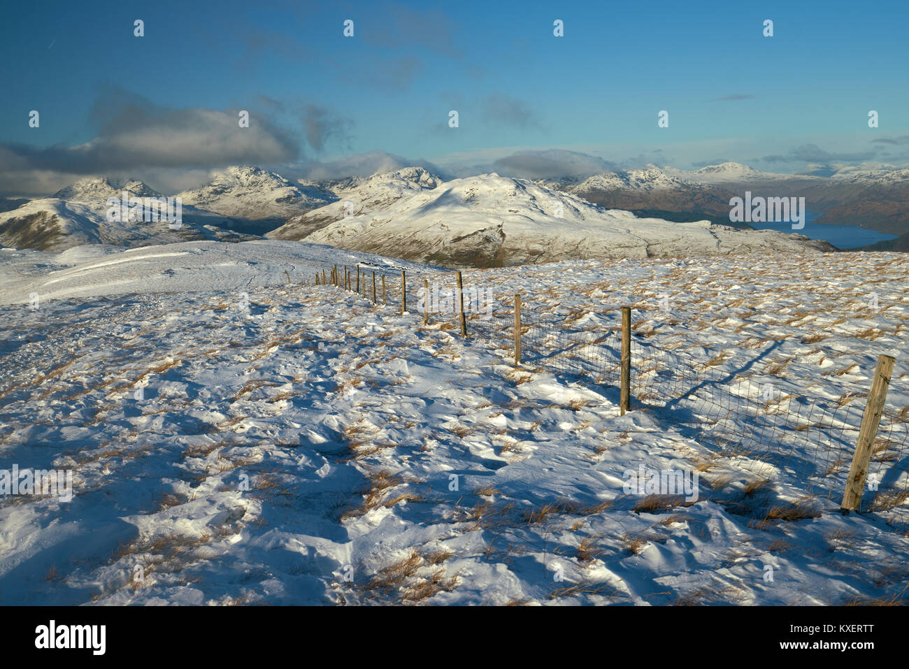 Snowy winter view from the summit of Beinn Dubh with Loch Lomond and the Arrochar Alps in the background. Scotland, UK. Stock Photo