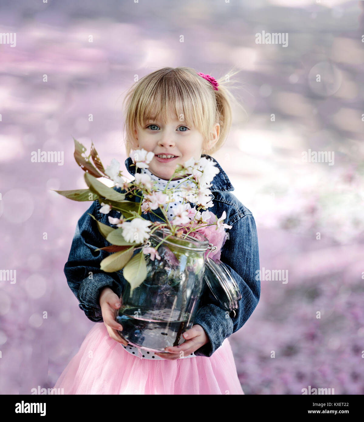 Portrait of a Girl and Cherry Tree Flowers in Spring Stock Photo