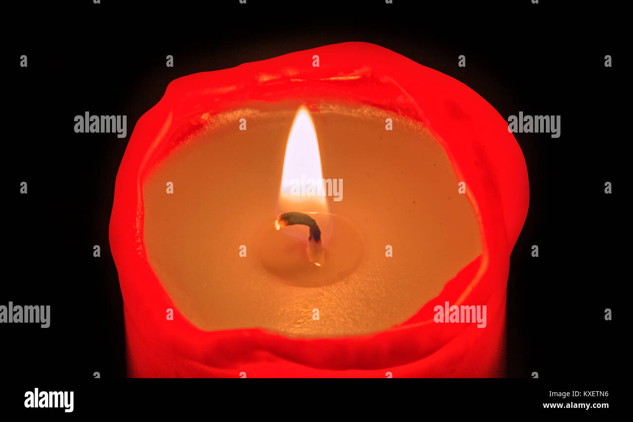 Red candle burning Stock Photo Alamy