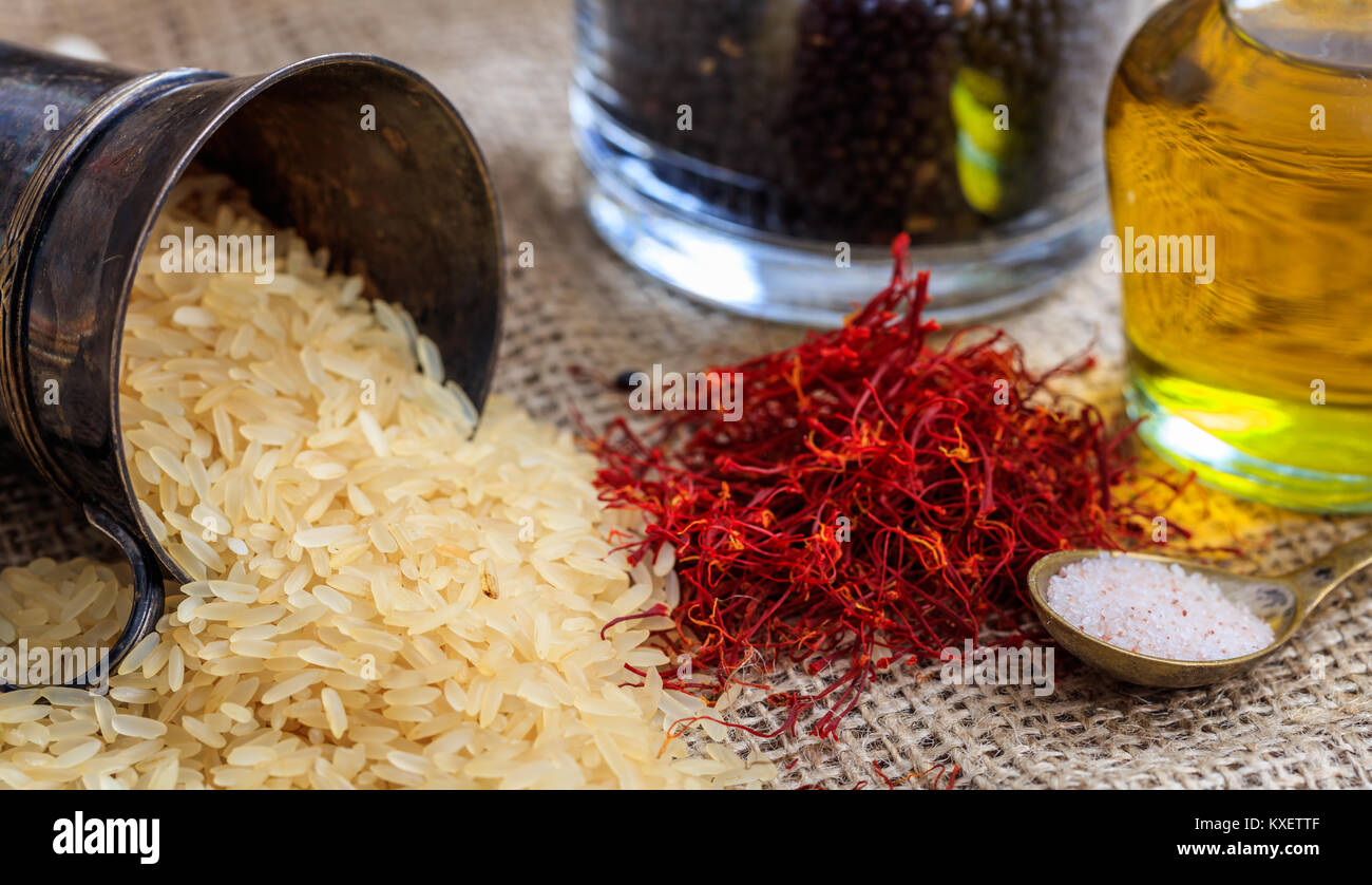 Embroils Rice Parboiled rice out of a bowl on a sackcloth Stock Photo - Alamy