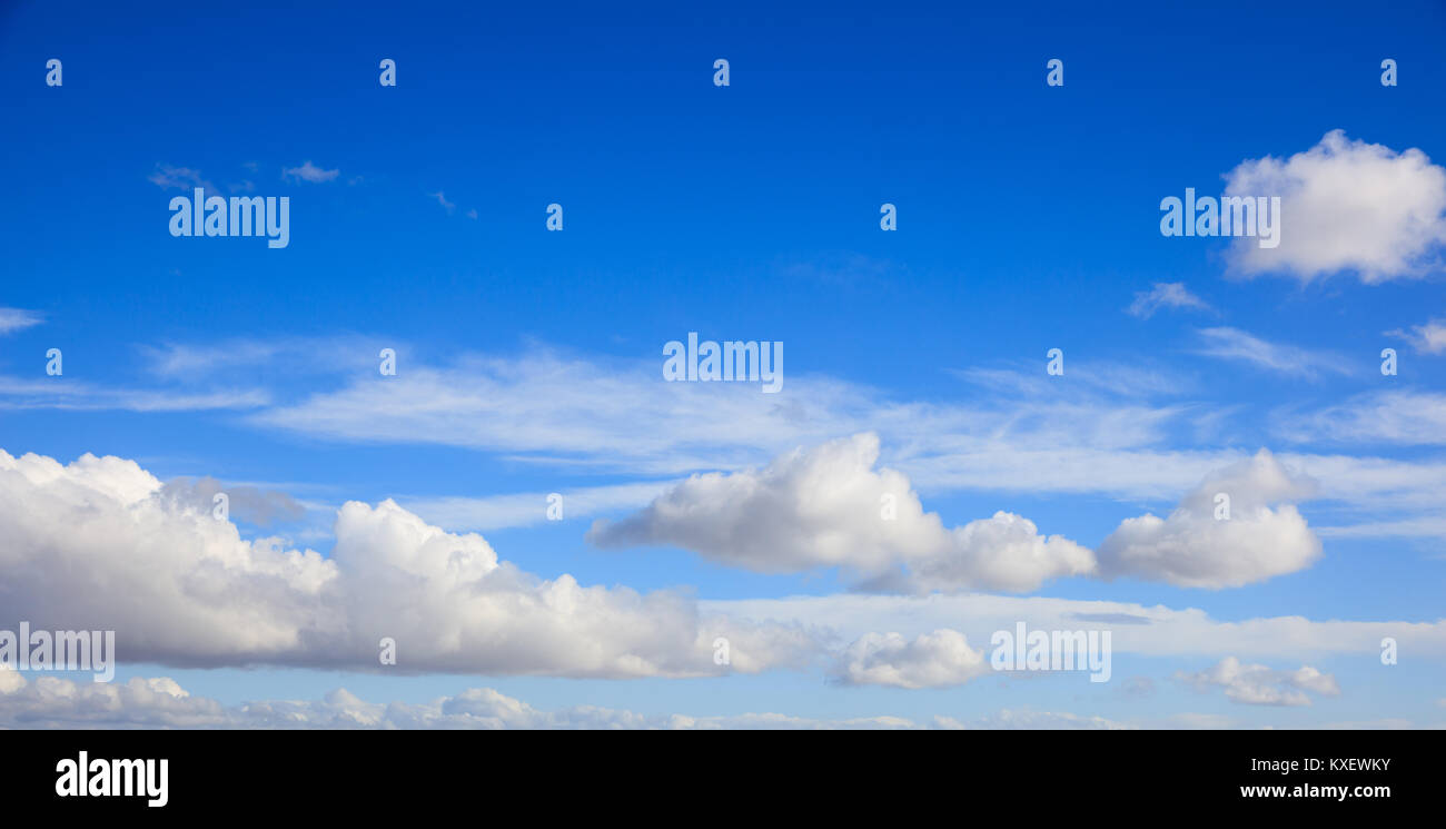 Scattered clouds on blue sky background, banner Stock Photo Alamy