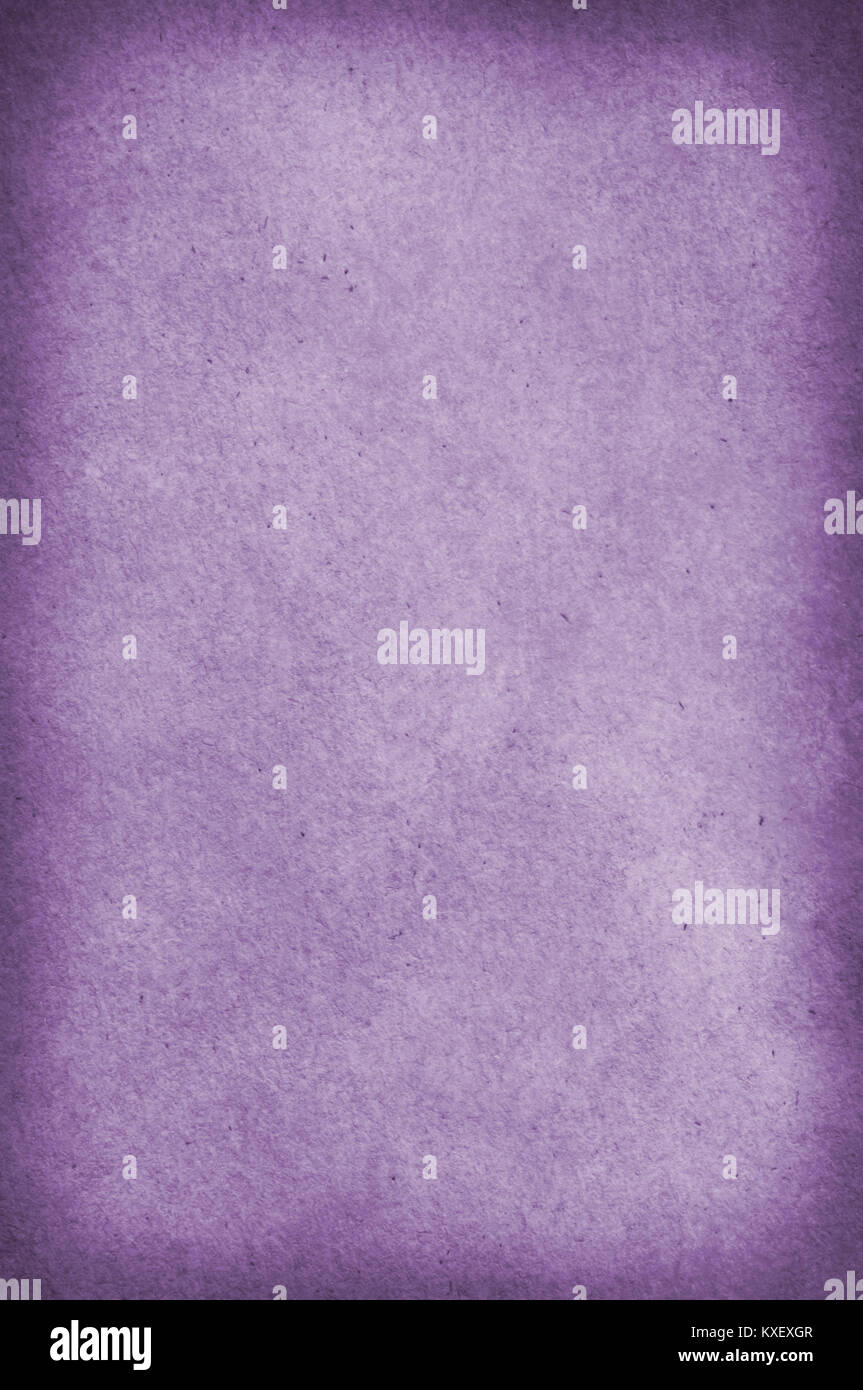 Paper background with organic wood flecked texture and vignette. Violet hue. Stock Photo