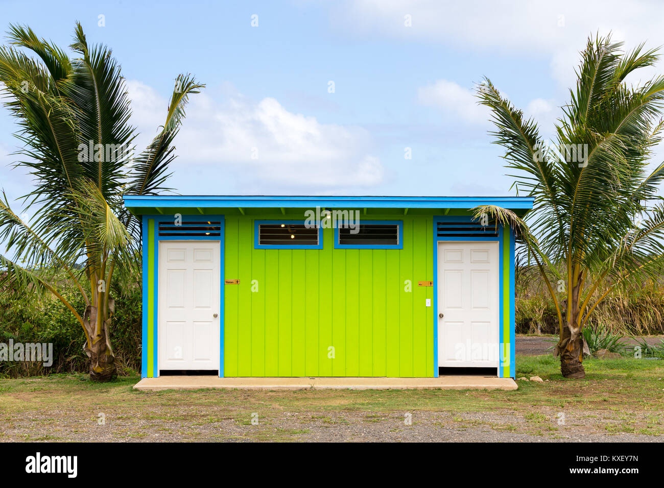 Bright colourful restroom facility Oahu, Hawaii with lime green wooden walls and dooors for men