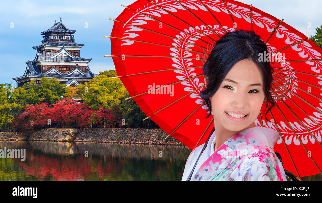 Young Japanese Woman in front of Hiroshima Castle Stock Photo