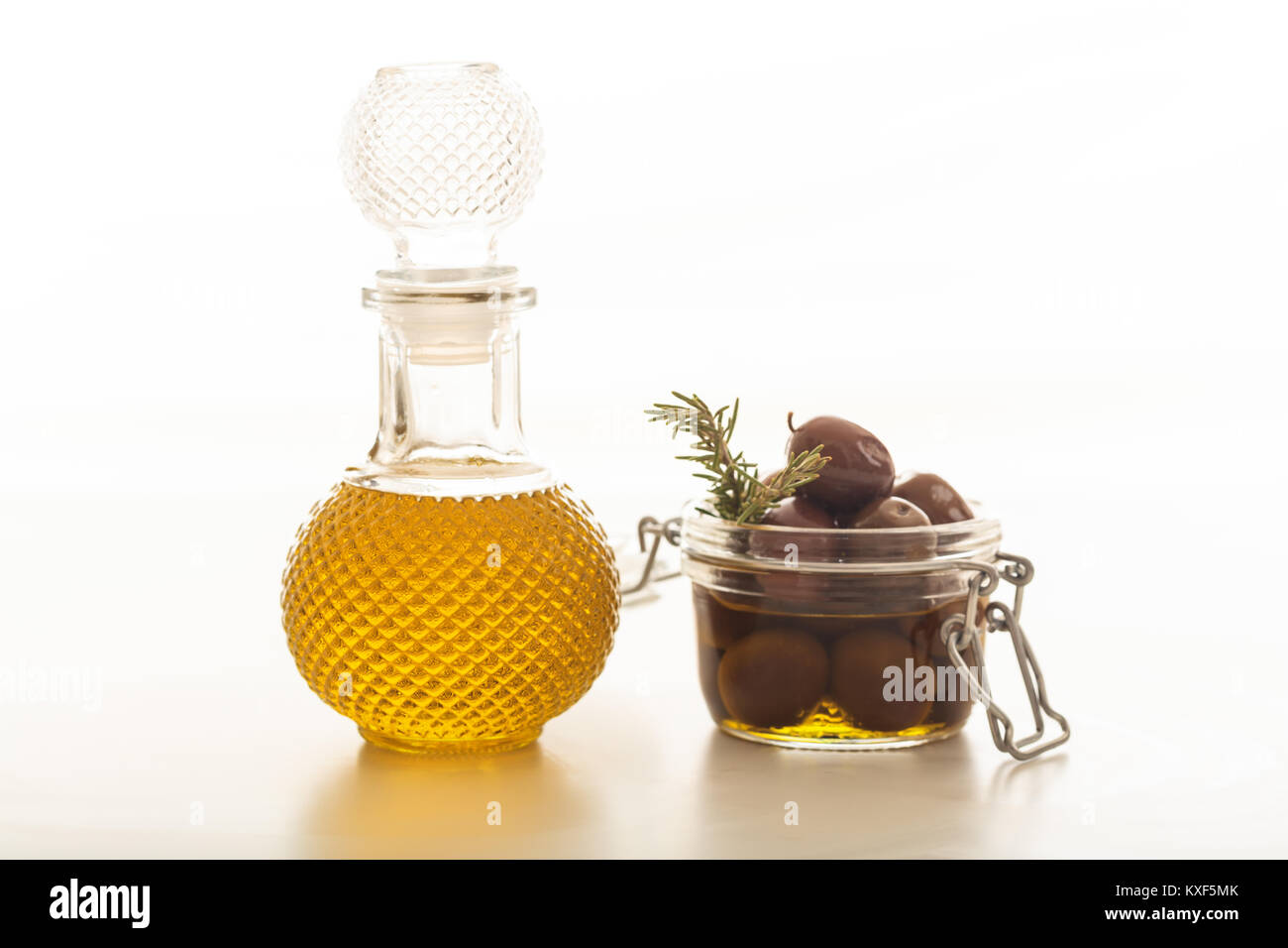 Bottle of olive oil and olives on white background Stock Photo - Alamy
