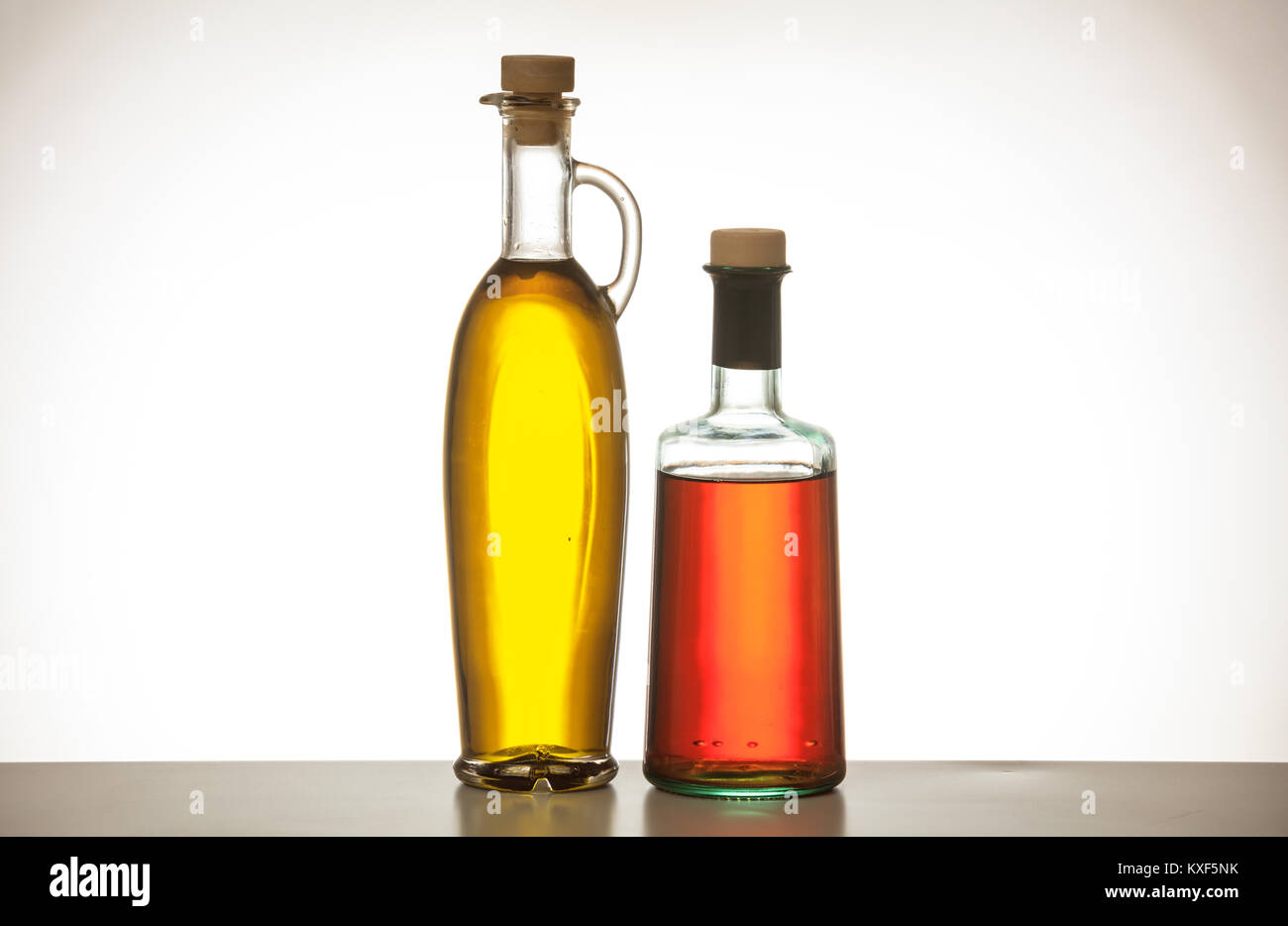 Olive oil and vinegar bottles on gradien background Stock Photo