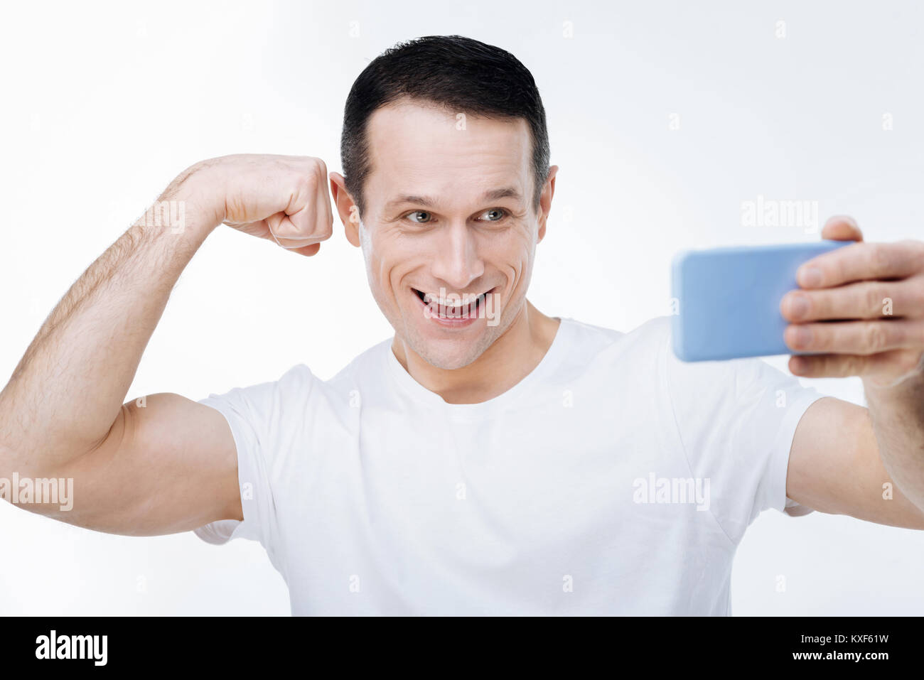 Strong well built man showing his biceps Stock Photo