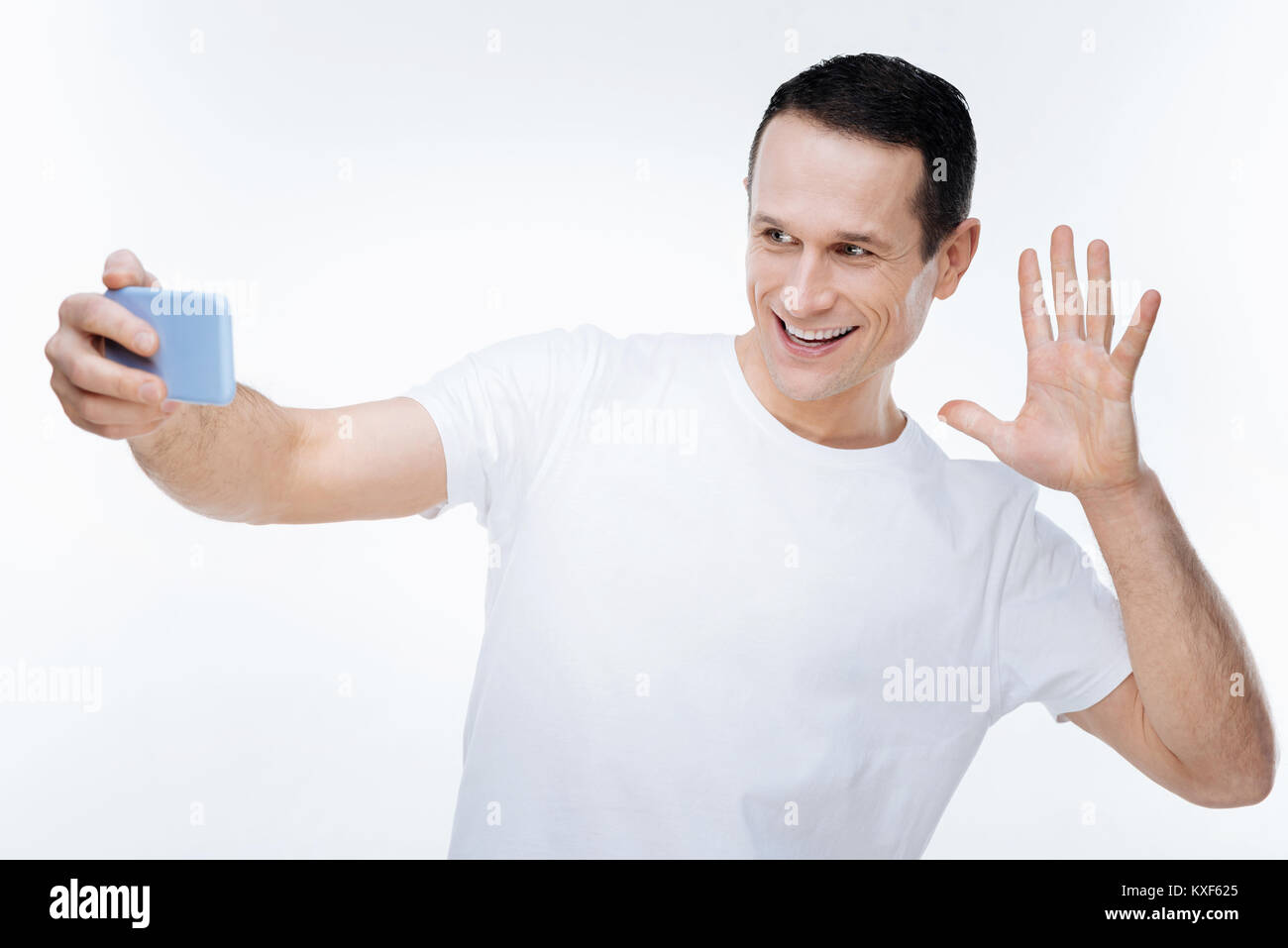 Happy cheerful man showing his hand Stock Photo