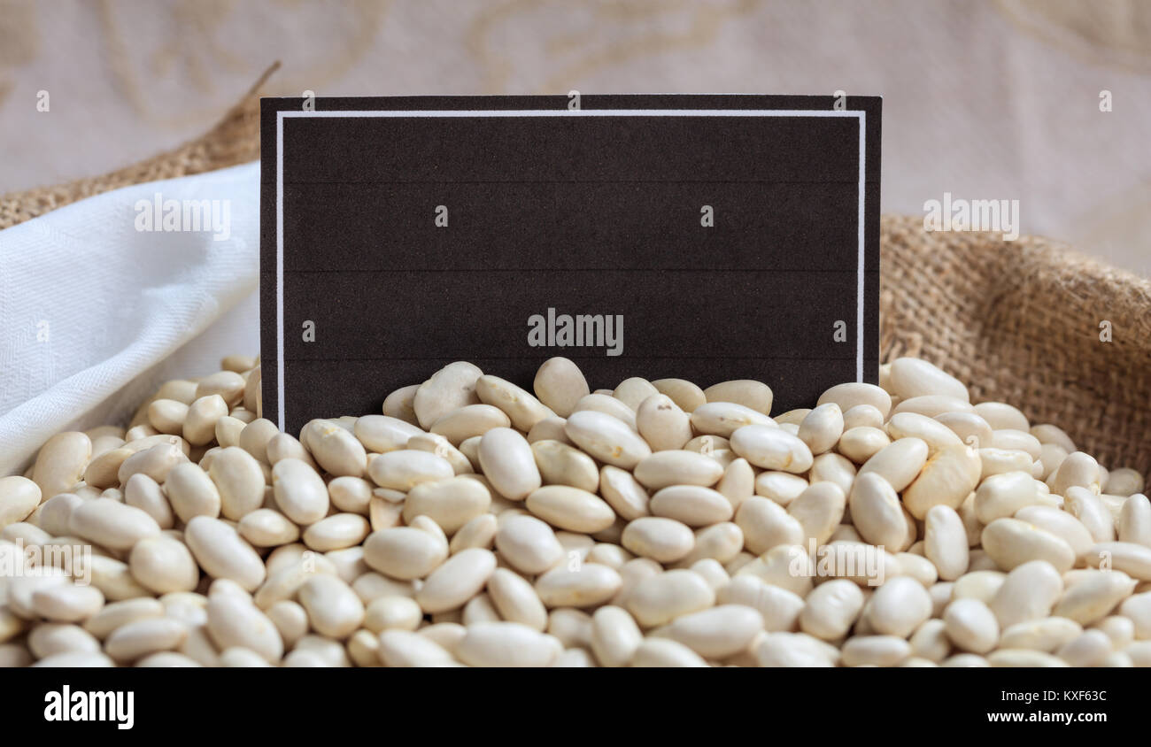 Lima beans in a sack with a black label Stock Photo