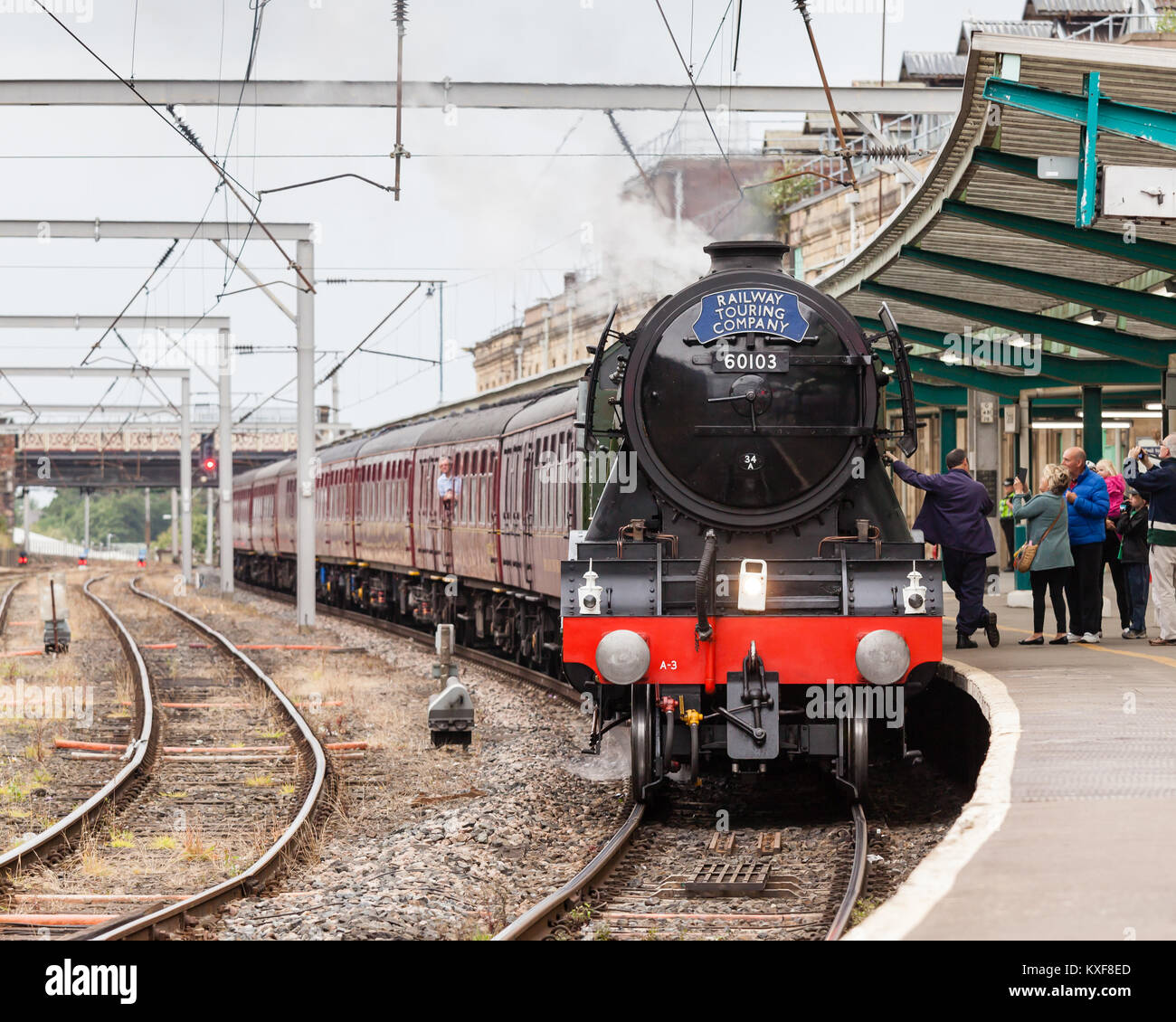 The Flying Scotsman, a preserved steam locomotive, heads The Waverley in Carlisle Citadel station in Cumbria. Stock Photo