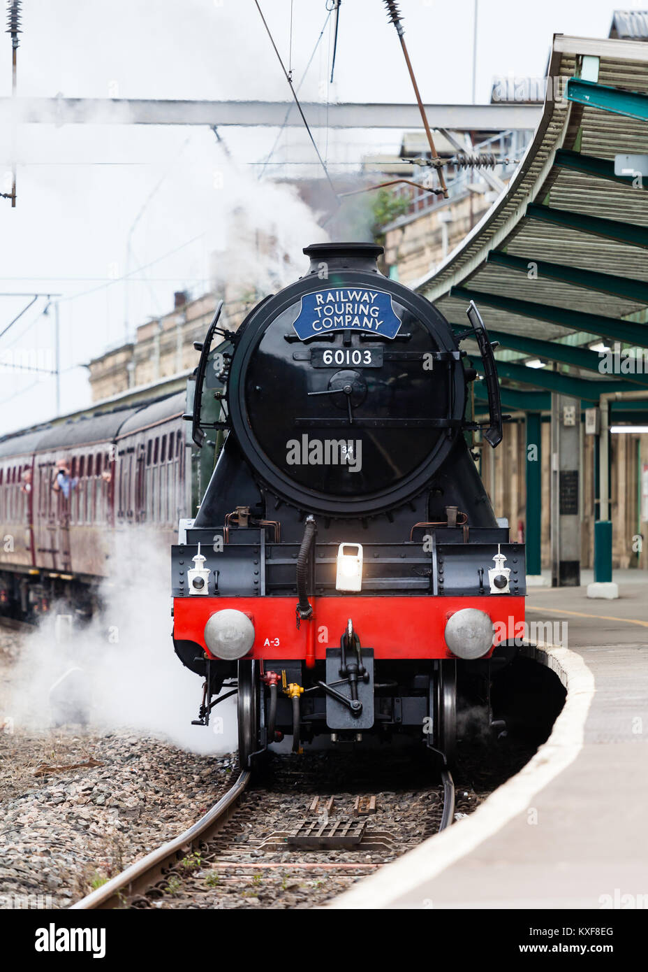 The Flying Scotsman, a preserved steam locomotive, heads The Waverley as it departs Carlisle Citadel station in Cumbria. Stock Photo