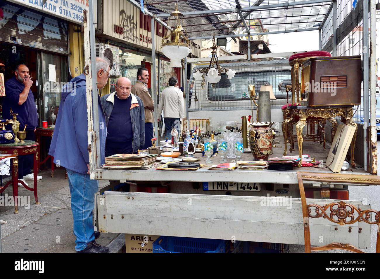 Back of lorry used as display in flea market with bric-a-brac end of Ermou street by Monstiraki Metro station , Athens, Greece Stock Photo