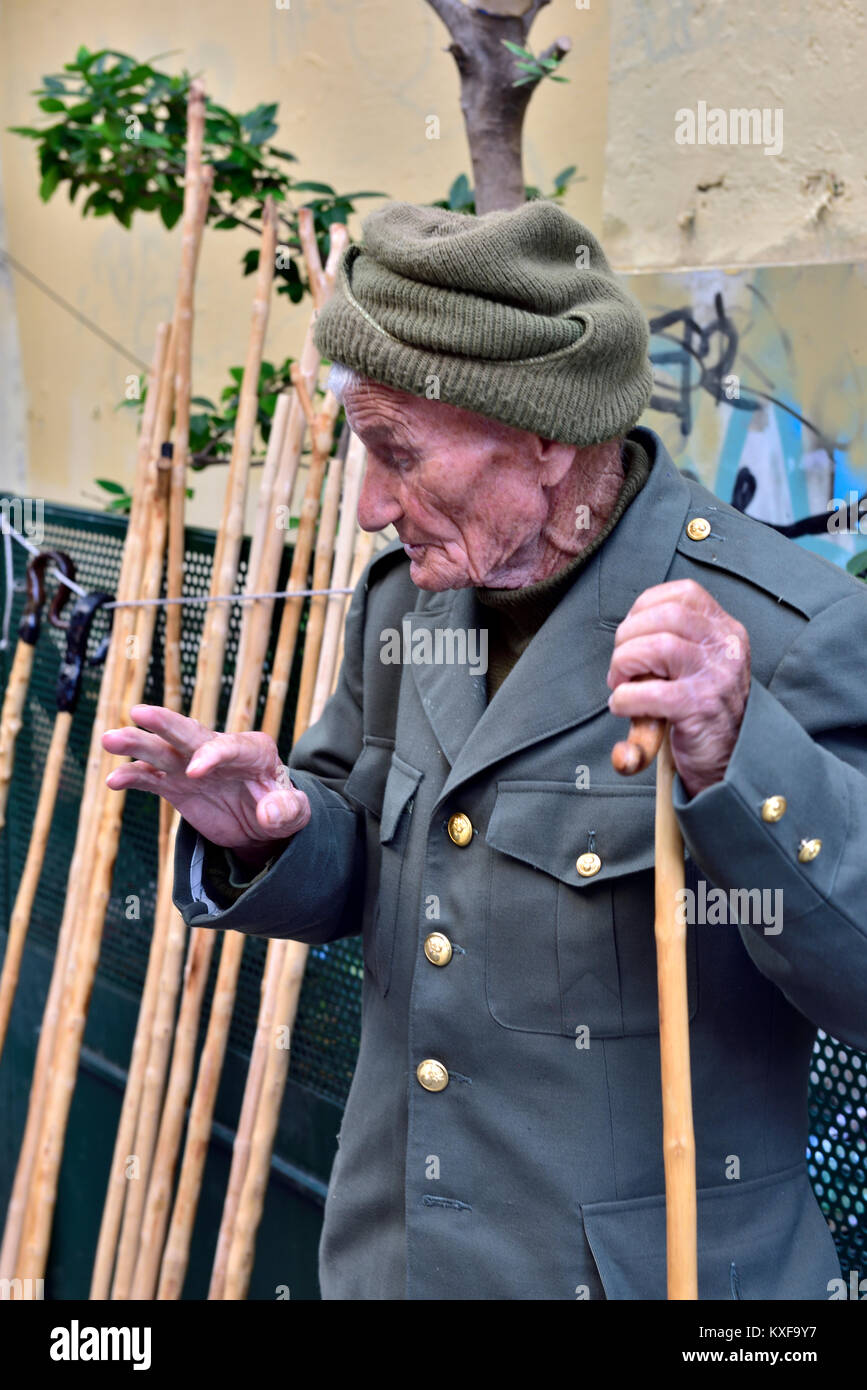 Man holding cane hires stock photography and images Alamy