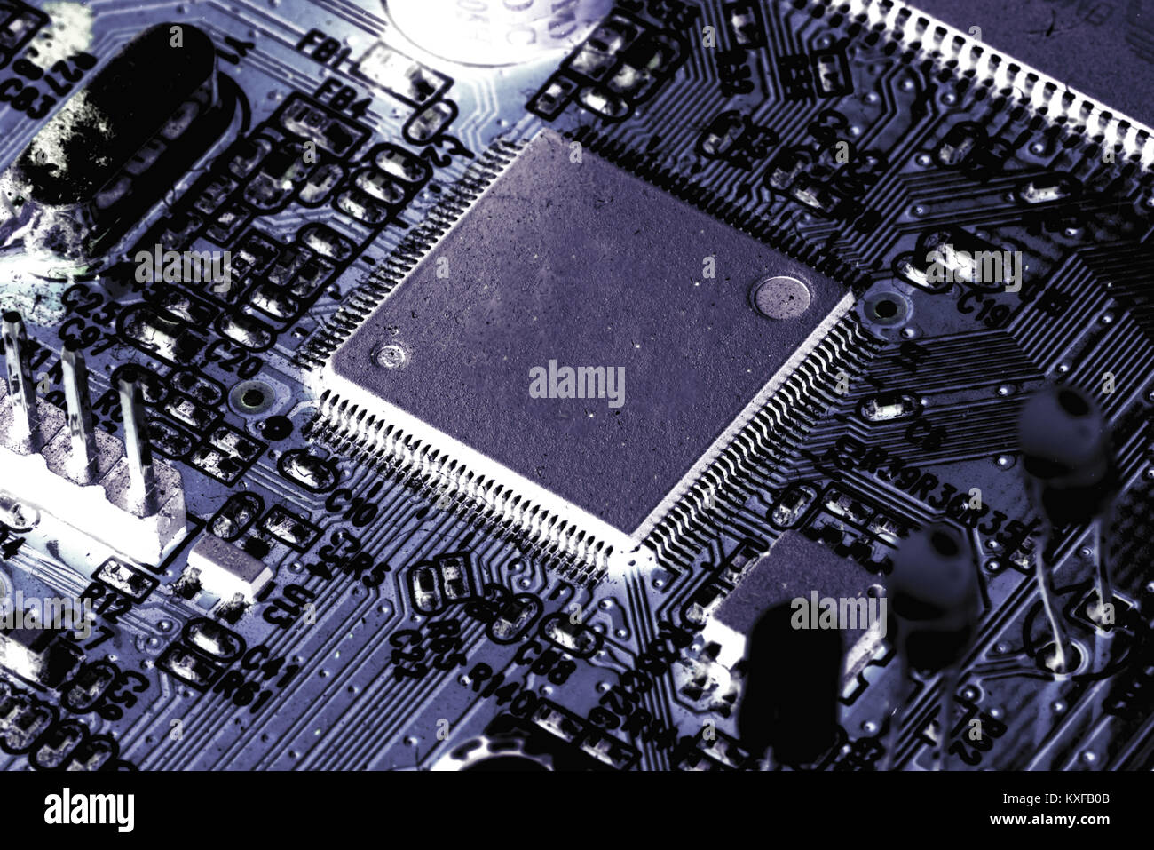 Electronic PCB printed circuit board in macro closeup with transistors