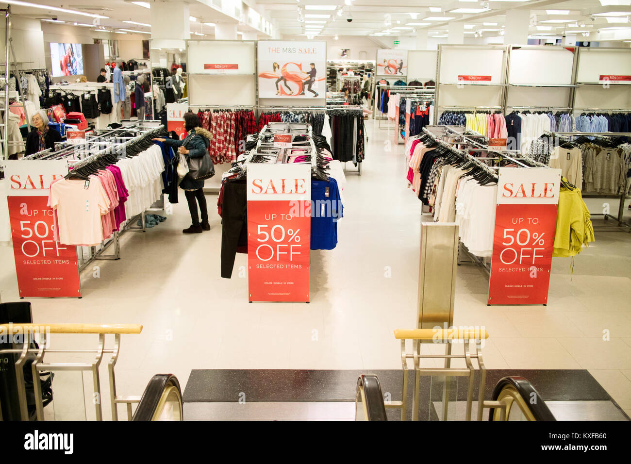 Sale at M&S clothes store 50% off Stock Photo - Alamy