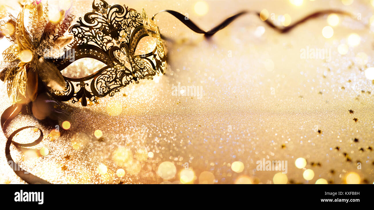 Venetian Golden Mask On Shiny Defocused Background Stock Photo