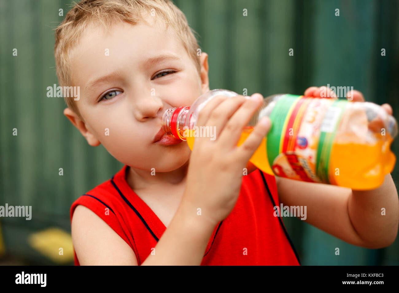 Child drinking unhealthy sweet bottled soda Stock Photo Alamy