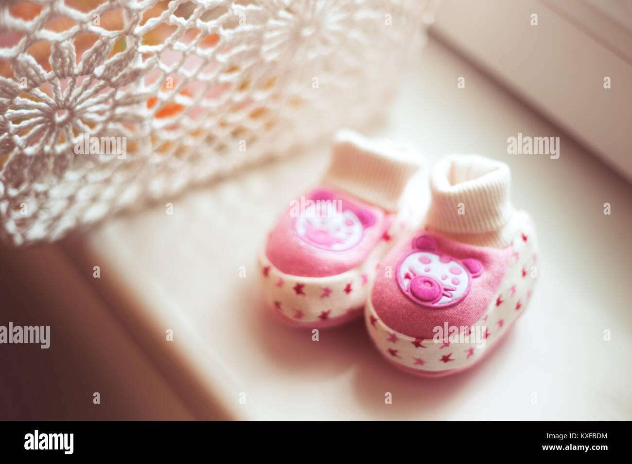 Pink baby shoes for newborn child Stock Photo - Alamy