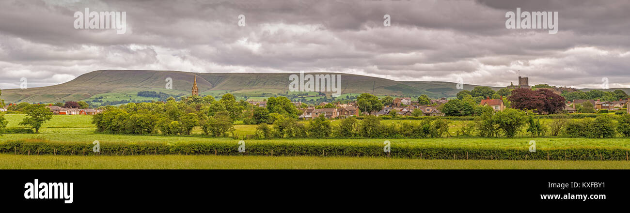 Pendle Hill in the Ribble Valley with historic Clitheroe Castle prominent in the sky line. The centre of the United Kingdom Stock Photo