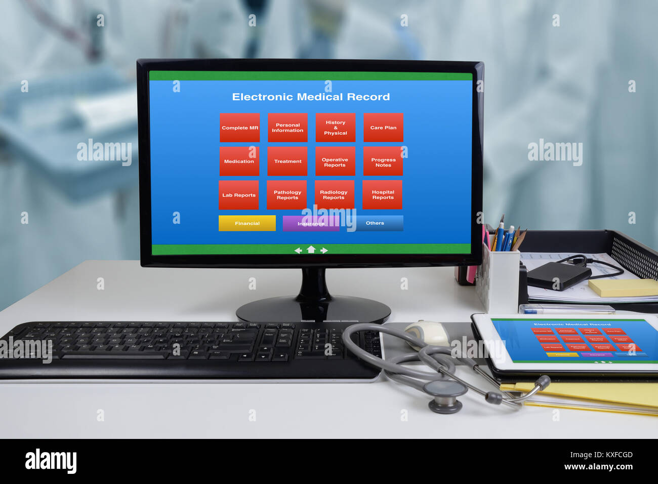 Computer on office desk showing EMR or electronic medical record menu
