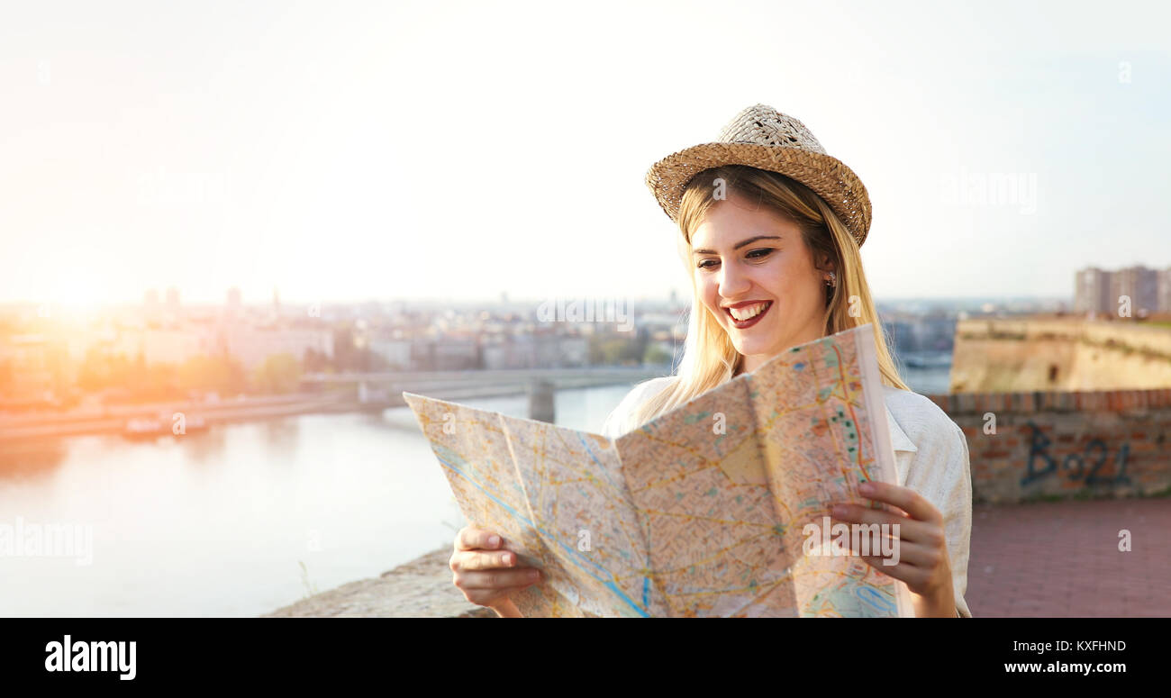 Tourist woman holding travelers map Stock Photo