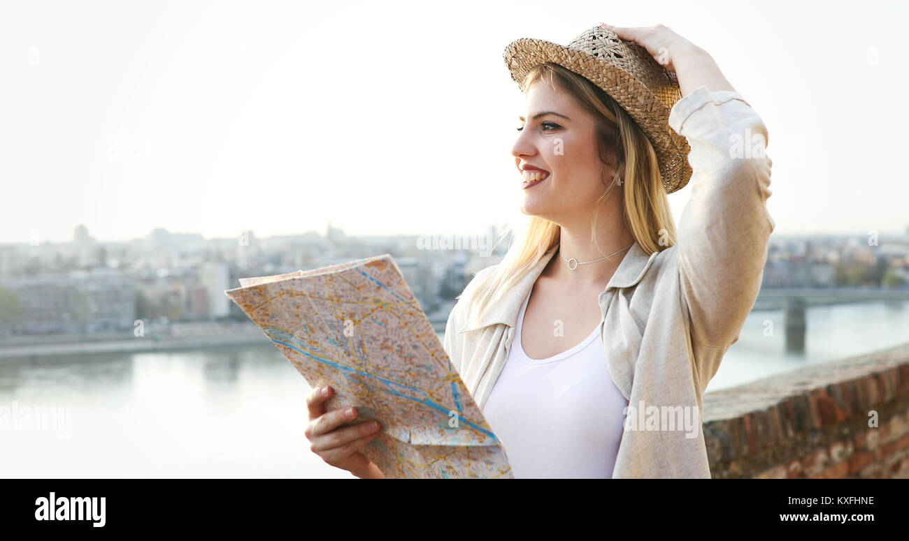 Happy blond female traveling and sightseeing Stock Photo