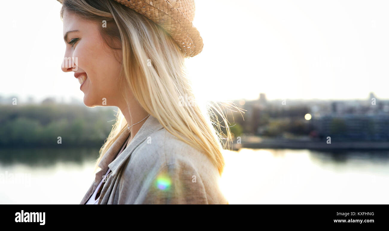 Happy blond female wearing hat outdoor Stock Photo