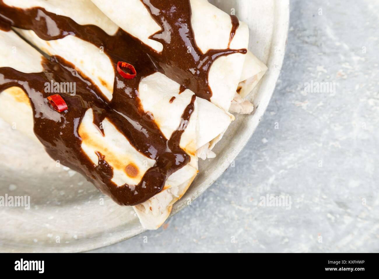 Mexican chicken enchiladas with chili chocolate salsa mole poblano