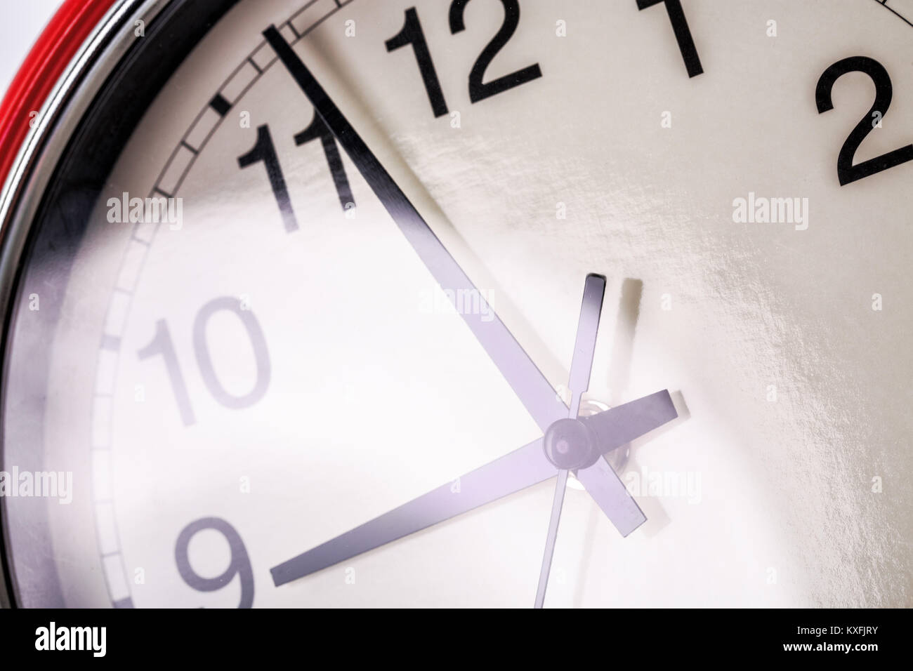 Red wall clock isolated on white background Stock Photo - Alamy