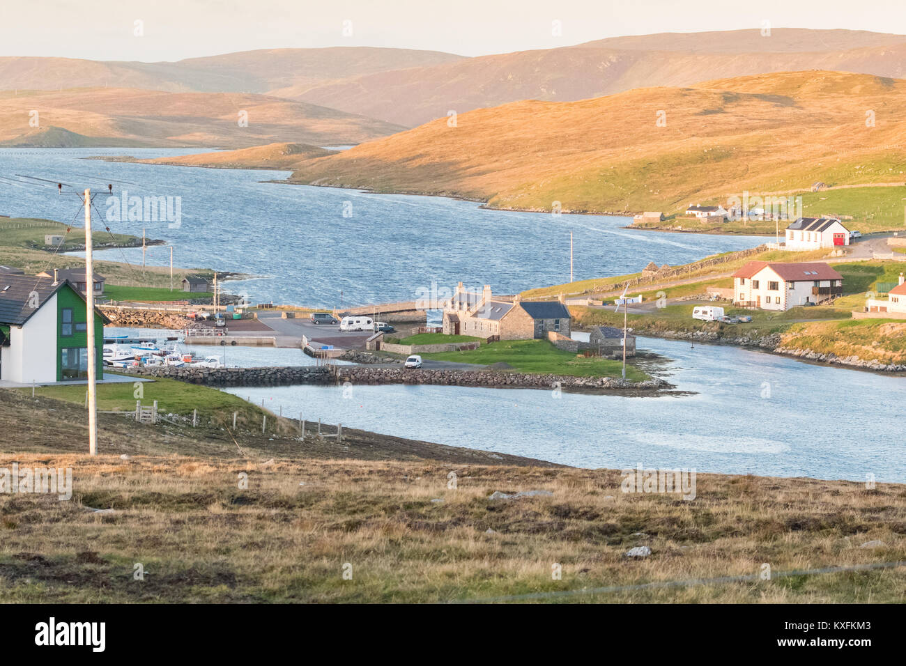 Bridge End Outdoor Centre and Marina at the head of South Voe with Lang Sound beyond seen from West Burra looking towards East Burra, Shetland Islands Stock Photo