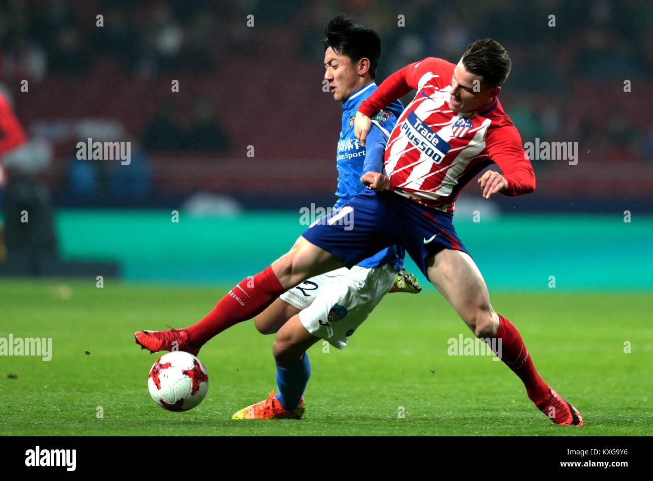 Madrid, Spain. 9th Jan, 2018. Lleida's Cheng Hui (L) and Atletico Madrid's Gameiro compete during the Spanish King's Cup round of 16 second leg match between Atletico Madrid and Lleida in Madrid, Spain, on Jan. 9, 2018. Atletico Madrid defeated Lleida with 3-0 and advanced to the quarterfinal with 7-0 on aggregate. Credit: Juan Carlos Rojas/Xinhua/Alamy Live News Stock Photo