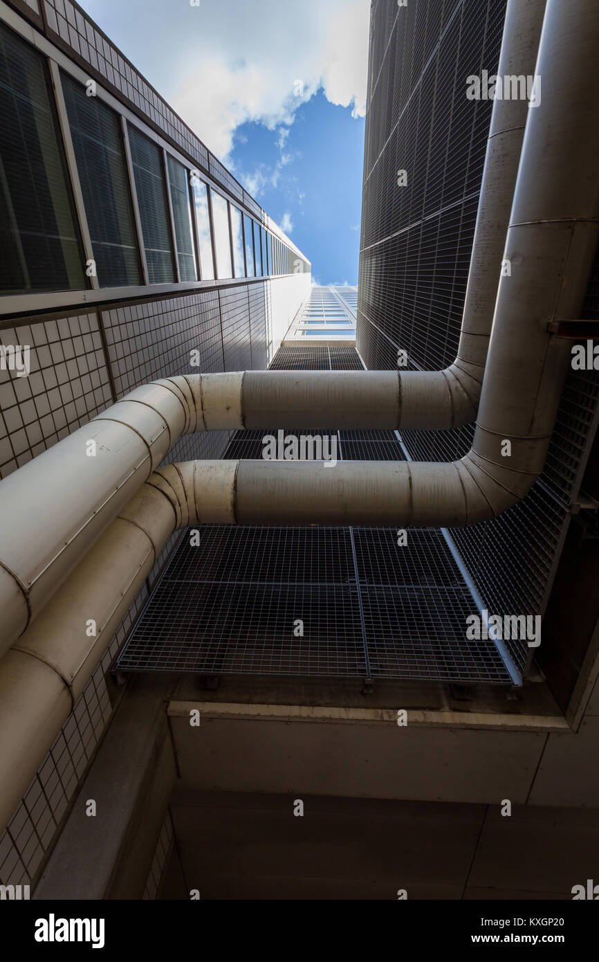 Air ducts installed in the Willemswerf office building under a blue sky with clouds in Rotterdam, The Netherlands. Stock Photo