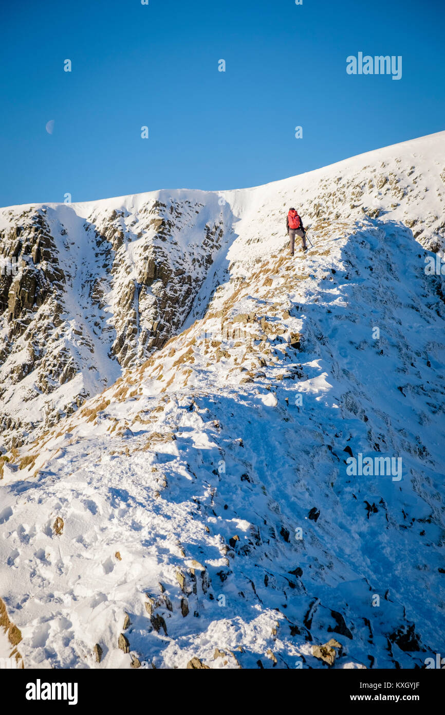 Heeling Ridge A Mountaineer taking on Striding Edge Ridge on The Helvellyn Mountain ...
